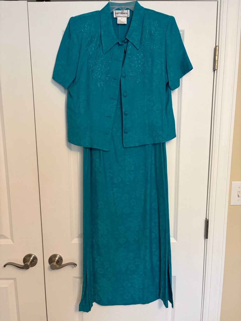 Karin Steven’s Teal Maxi Skirt Set with Short Jacket